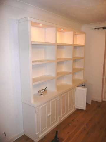 Custom fitted alcove units with open shelving in Cambridge home